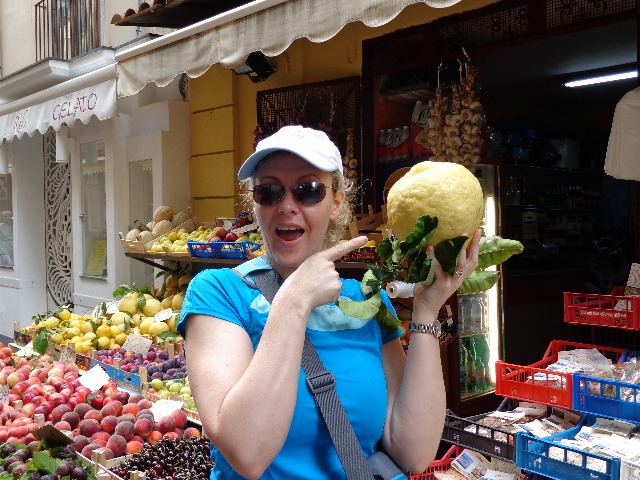 Nancy checking out the huge lemon in Sorrento during her Black Sea Cruise