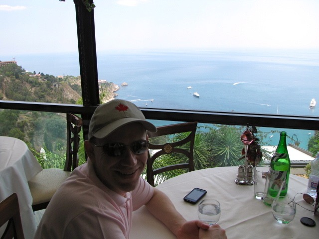 Shawn enjoying lunch with beautiful views from Taormina during his Balck Sea Cruise