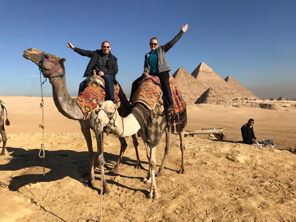 at the pryamids riding camels