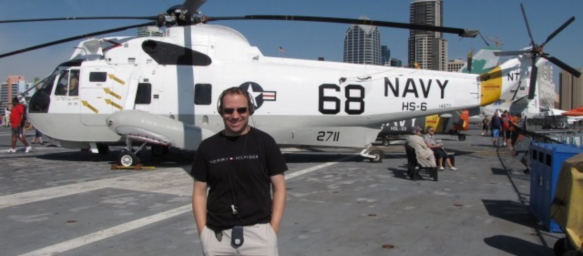 Shawn Power checking out a Navy Helicopter on the USS Midway Aircraft Carrier